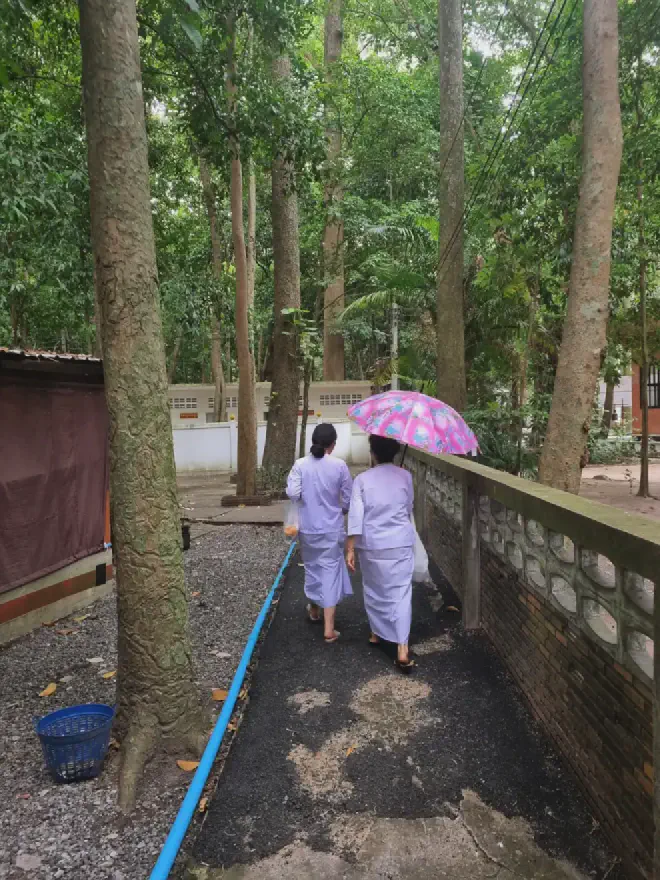 “Making our way through the temple grounds to our new room”